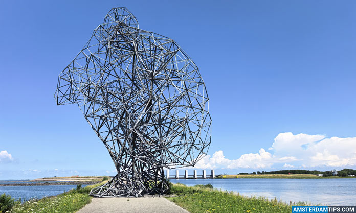 antony gormley exposure with Houtribsluisbrug bridge in the distance