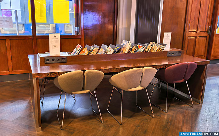 ns international lounge amsterdam - reading table